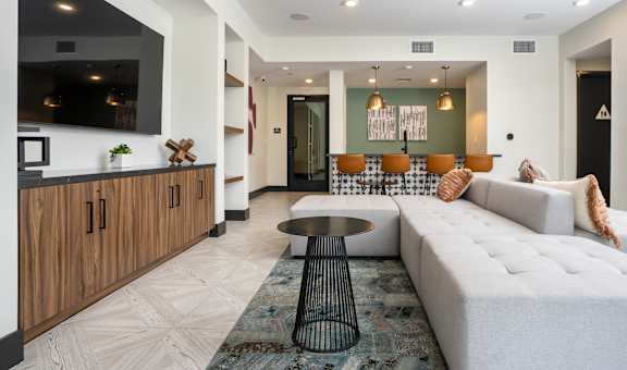 a living room filled with furniture and a large window