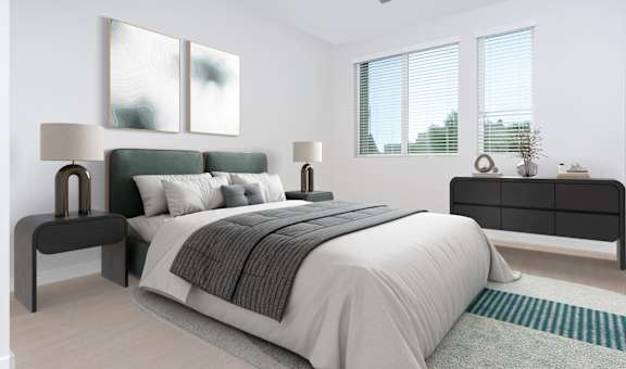 a bedroom with a bed and two windows