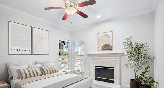 a bedroom with a bed and a fireplace