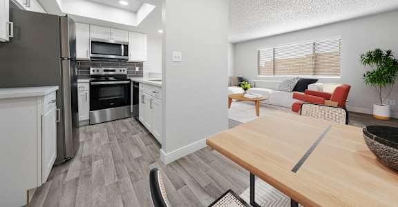 A modern kitchen with a wooden table and a refrigerator.