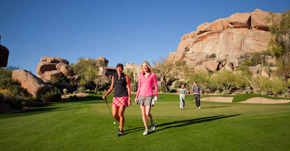 people walking on the golf course