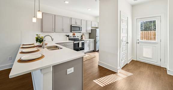 Large kitchen with island seating at Turnberry Park Apartments in Gardendale, AL