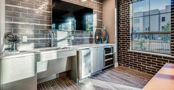 A bathroom with a double sink vanity and a large mirror.