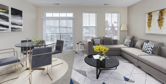 a bedroom with a large bed and a ceiling fan at Monmouth Row Apartments, Newport, KY, 41071