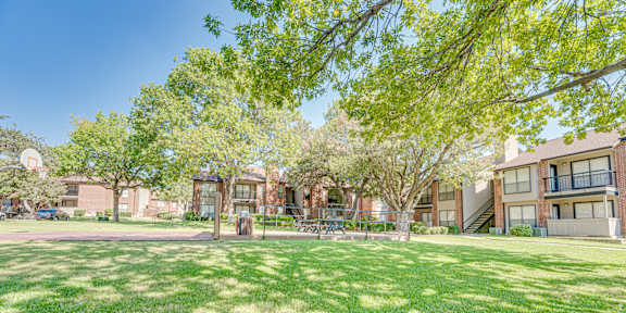 Garden With Green Lawn at Bardin Oaks Apartments, Arlington