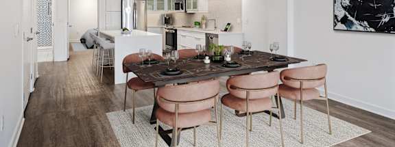 a living room and dining room with a table and chairs