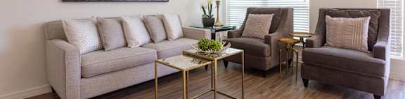 a living room with a couch chair and coffee table