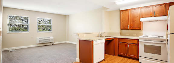 A bedroom with a bed, desk, and chair.