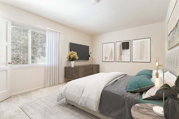 A bedroom with a large bed and a window with curtains.