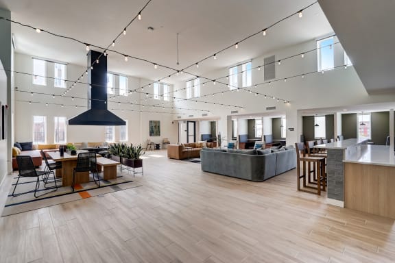 a large open space with hardwood floors and a large fireplace