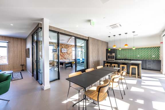 A conference room with a long table and chairs.