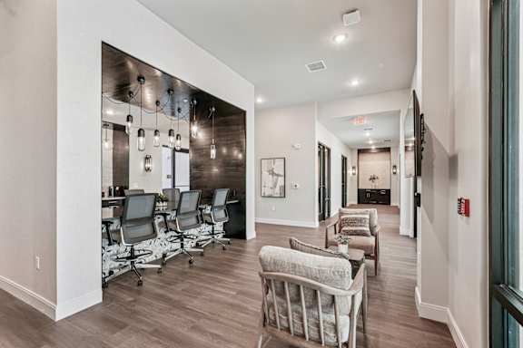 A conference room with a long table and chairs at The Stadler Luxury Apartments, Florida
