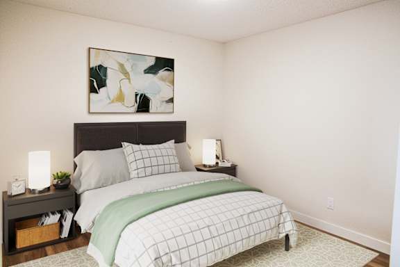 a bedroom with a bed and a painting on the wall