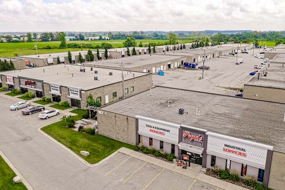 A large industrial supplies store with a parking lot in front.