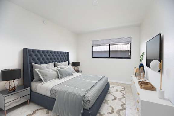 a living room with a couch and a ceiling fan