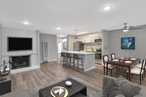 a living room with a fireplace and a table with chairs