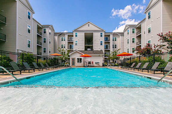 A large swimming pool in front of apartment buildings. at Kensington Place Apartments, Virginia