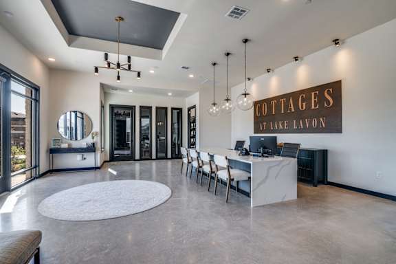 A large open space with a sign that says "Cottages at Lake Lavon".