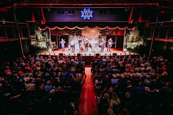 a crowd of people watching a show on a stage