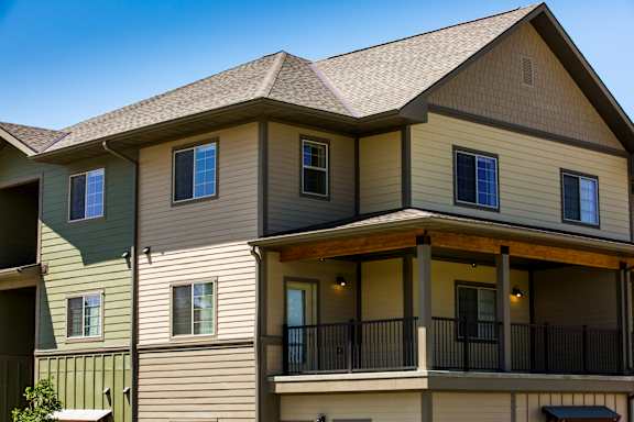 Image of building and balcony on one of units