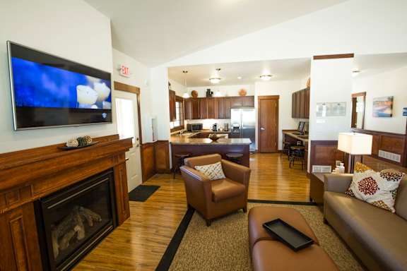 Image of television and fire place along with a couch