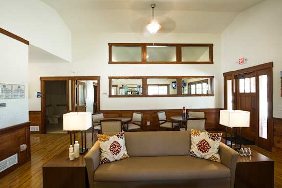 Image of doors, entry to bathroom, and mirrors on wall