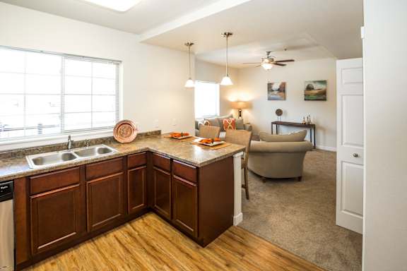 Imaged of counter space, cabinets, dishwasher, and sink