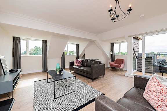 a living room with couches and a coffee table