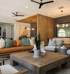 a living room with couches and chairs and a table