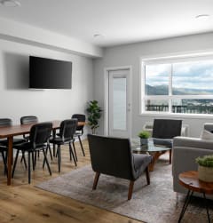 a living room with couches a coffee table and a television