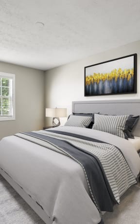 a bedroom with a bed and a chair