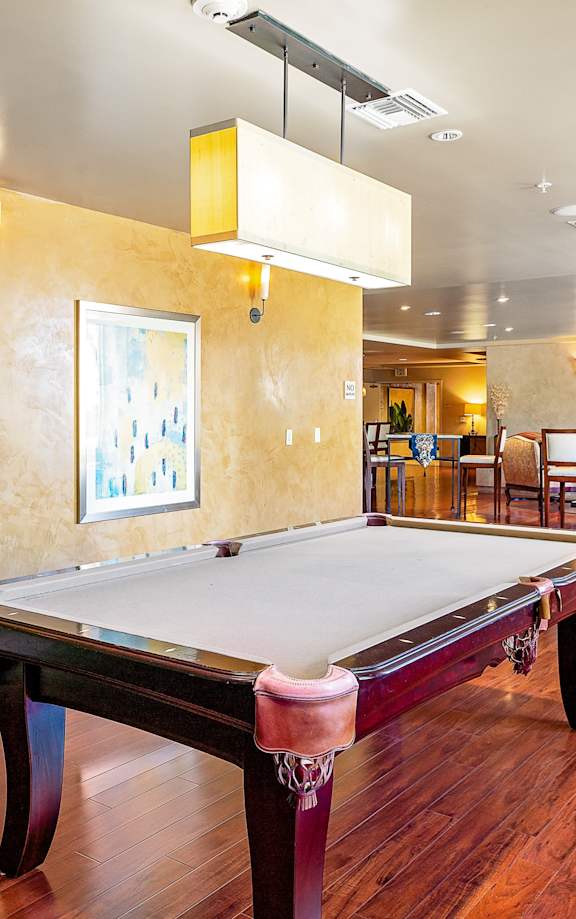 a game room with a pool table and ping pong