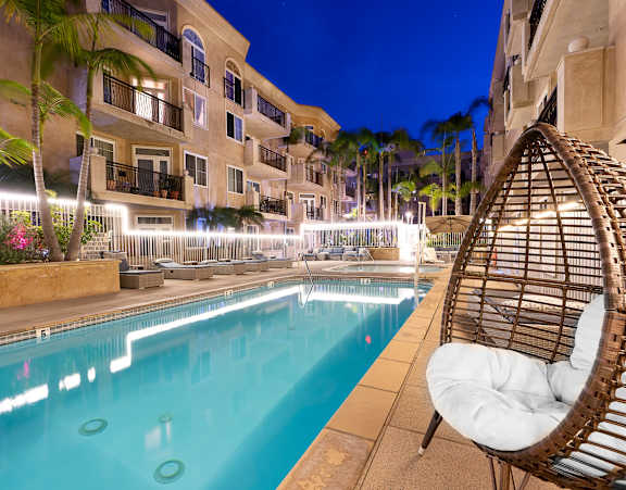 Nightime pool shot with lounge seating