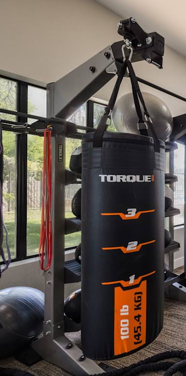A Gym With Weights at Odyssey Apartments, Albuquerque