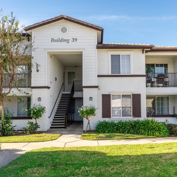 Exterior View of Barrington Place Apartments Building Surrounded By Lush Landscaping at Barrington Place, Rancho Cucamonga, CA, 91739
