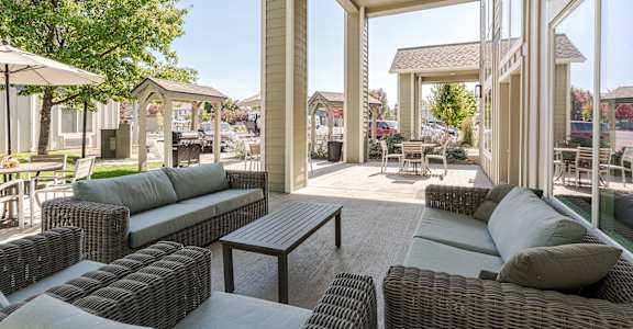 A patio with a table and chairs is shown.
