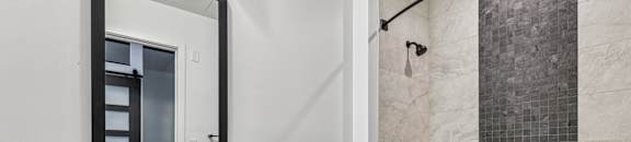 A white sink with a mirror above it and a white toilet next to a bathtub.