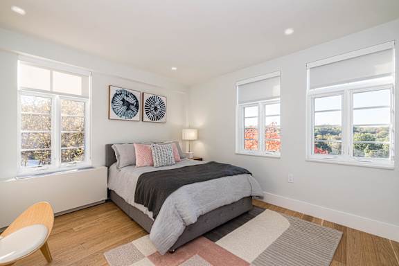 bedroom with hardwood floors and great natural light