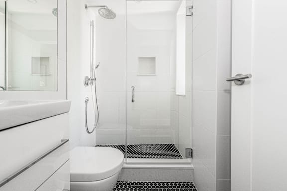 stylish bathroom with chrome fixtures and a rain shower