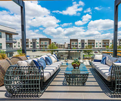 a rooftop patio with couches and a coffee table at Presidium Revelstoke, Texas