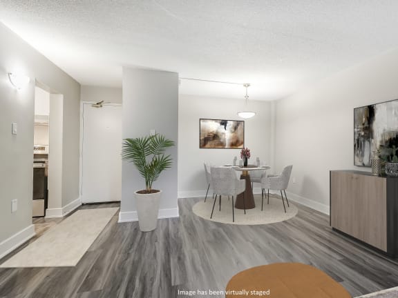 a bedroom with hardwood floors and a large window at Platts Crossing, London, ON