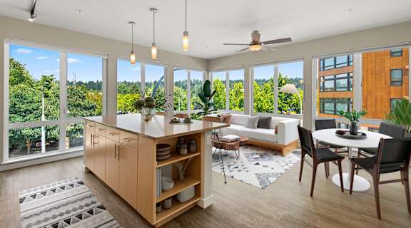 Living and dining area with a kitchen and a large window at Allez, Redmond, WA 98052