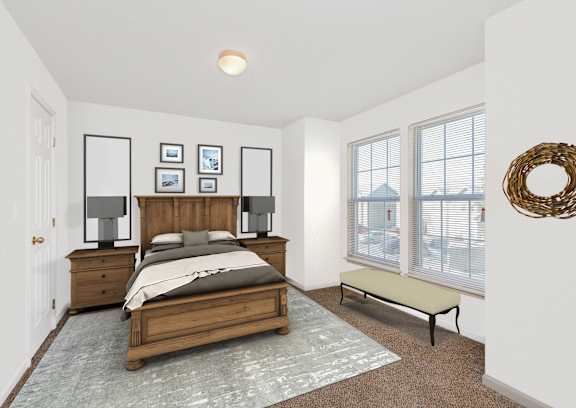 A bedroom with a bed, nightstands, and pictures on the wall.