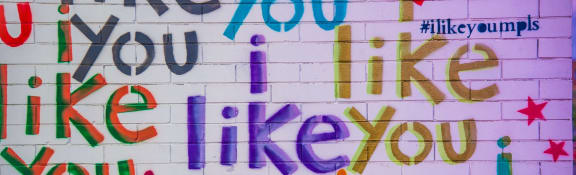 a mural of the words like you like you on a brick wall