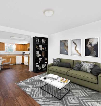 A living room with a green couch and a coffee table.