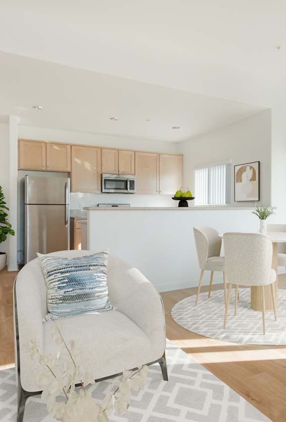 A modern living room with a white sofa and a television.at Grand View Towers, California