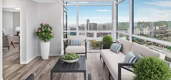 A modern living room with a view of the city skyline.