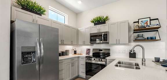 Gourmet Kitchen with Island at Avilla Cypress Creek, Sun City Center, FL 33573