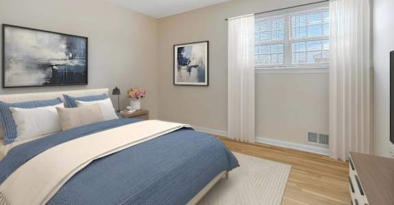 A bedroom with a large bed and two framed pictures on the wall. at Chatham Hill, New Jersey, 07928