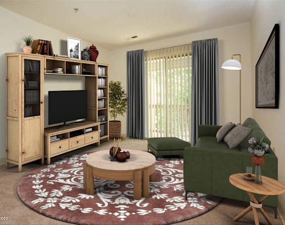 a living room with a green couch and a television